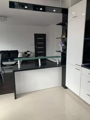 a kitchen with a glass counter top in a room at Luxury Apartment Eleni in centre of Sandanski in Sandanski