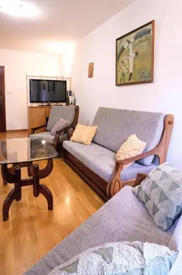 a living room with a couch and a table at Домът на архитекта The Architect's Home in Plovdiv