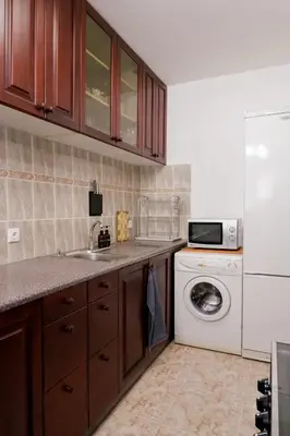 a kitchen with a sink and a washing machine at Домът на архитекта The Architect's Home in Plovdiv