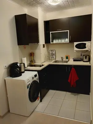 a kitchen with a washing machine and a sink at JESY apartment,Borovets Gardens in Borovets