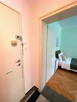 a door leading to a bedroom with a bed at Bohemian Bright & Calm 2BR - Top center - Private Balcony in Sofia