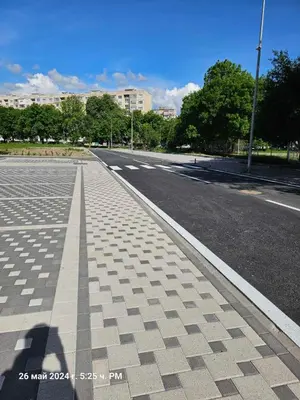 an empty street in a city with buildings in the background at Dilyanka 2 in Pernik
