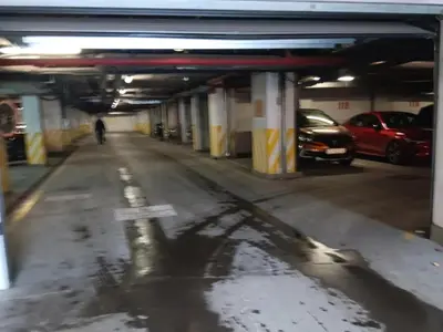 an empty parking garage with cars parked in it at Doble next to Bulgaria mall, FREE underground parking in Sofia