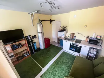 a room with a living room with a kitchen and a living room at Private studio in the city center, close to subway, Medical University in Sofia