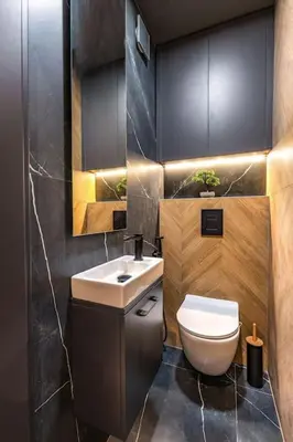 a bathroom with a white toilet and a sink at Sunset 2BR Apartment Central Street PARKING Included in Plovdiv