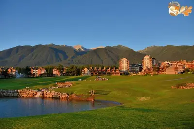 a golf course next to a body of water at Стаи за гости Божана in Razlog