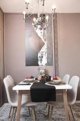 a dining room with a table with a chandelier at Rome Stylish apt w Working Space and Paid Parking Spot in Sofia