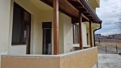 a house being constructed with windows and a porch at Апартаменти Недялкови I in Sandanski
