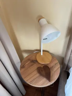 a table with a heart on it with a lamp at Роси Студио Банско in Bansko