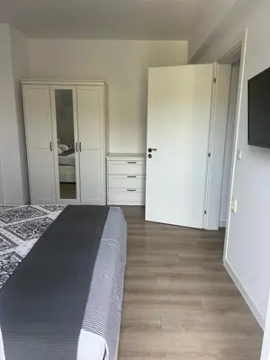 a bedroom with a bed and two closets at Sandanski escape in Sandanski