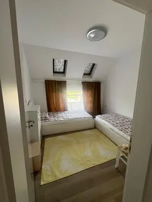 a small room with two beds and a window at Sandanski escape in Sandanski