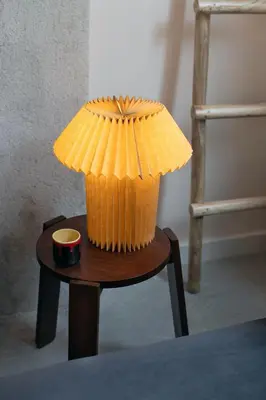a small table with a paper umbrella on it at Dazzling Minimalist One Bedroom Apartment in Sofia