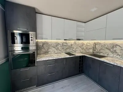 a kitchen with white cabinets and a microwave at West Park Apartment in Sofia