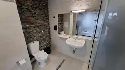a bathroom with a toilet and a sink at RCR Einstein studios 2 in Sofia