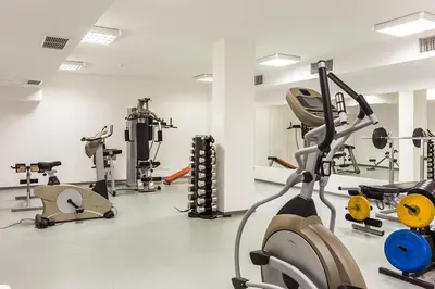 a gym with several treadmills and exercise equipment at MyPlace Pamporovo 2 in Pamporovo
