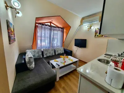 a living room with a couch and a table at Апартаменти Лили in Devin