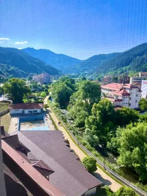 a view of a town with a river and mountains at Апартаменти Лили in Devin