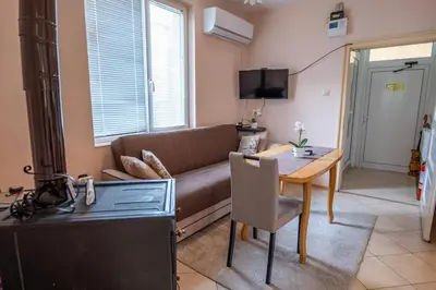 a living room with a couch and a table at Kostenets Hills in Kostenets Village