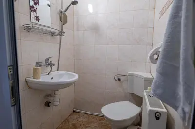 a bathroom with a toilet and a sink at Kostenets Hills in Kostenets Village