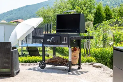 a barbecue grill with a tv on top of it at Kostenets Hills in Kostenets Village