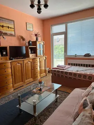a living room with two beds and a glass table at Apartment11in the center of Sofia in Sofia