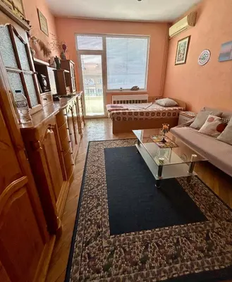 a living room with a couch and a table at Apartment11in the center of Sofia in Sofia