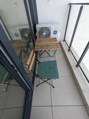 an overhead view of a balcony with a fan and a chair at Reina Apartment- next to Sofia zoo and close to Mall Paradise in Sofia