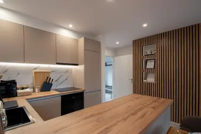 a kitchen with a wooden counter top in a room at Hyggemate - Nordic Villa with Sauna & Jacuzzi Retreat in Sarnitsa