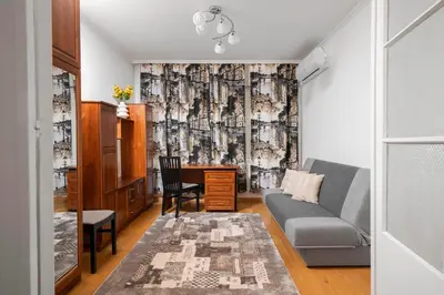 a living room with a couch and a desk at 1BD flat with Desk on Russian Monument Square by Flat Mаnager in Sofia
