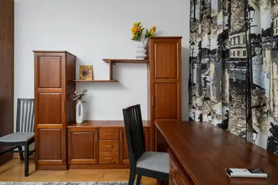 a home office with a wooden desk and chairs at 1BD flat with Desk on Russian Monument Square by Flat Mаnager in Sofia