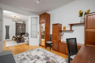 a living room with a table and a dining room at 1BD flat with Desk on Russian Monument Square by Flat Mаnager in Sofia