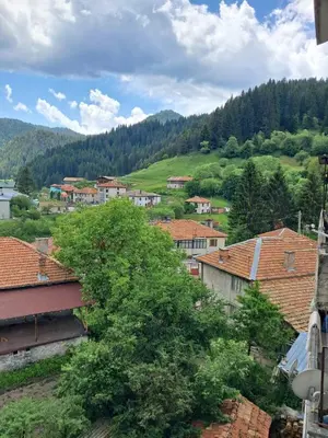 a view of a town with mountains in the background at Katerci in Trigrad