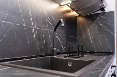 a kitchen sink with a faucet on a counter at 1-Bedroom apartment with Free Private parking in Plovdiv