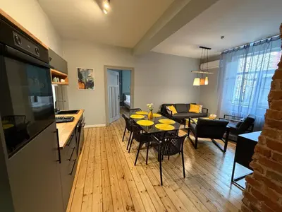 a kitchen and living room with a table and chairs at Sofia Vibes - Friends & Family Stay in Sofia