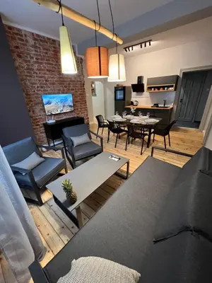 a living room with a couch and chairs and a table at Sofia Vibes - Friends & Family Stay in Sofia