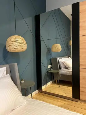 a bedroom with a mirror and a bed at Sofia Vibes - Friends & Family Stay in Sofia