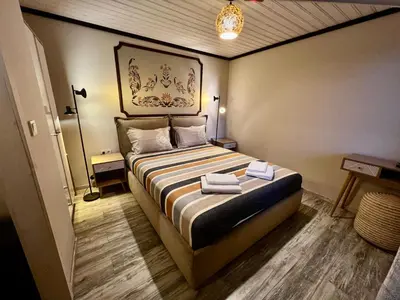 a bedroom with a bed with two towels on it at Китанова къща in Koprivshtitsa