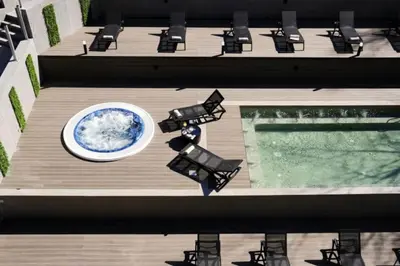 an overhead view of a deck with chairs and a pool at Wonderful ski resort apartment in Bansko