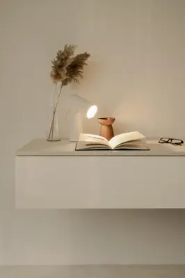 a book on a shelf with a lamp and glasses at Hotel Hello Plovdiv - Free Parking and Pet Friendly in Plovdiv