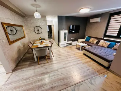 a living room with a couch and a table at ДиНати in Plovdiv