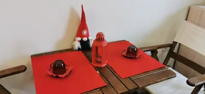 a table with a santa hat and red napkins at Blue sea in Sofia
