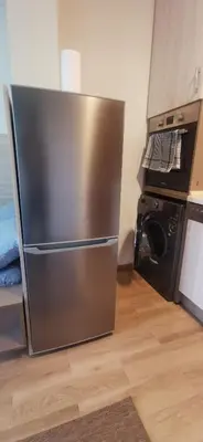 a stainless steel refrigerator in a kitchen with a stove at Blue sea in Sofia