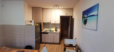a kitchen with a refrigerator and a sink in it at Blue sea in Sofia