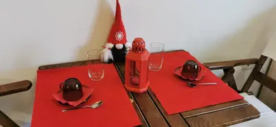 a table with red napkins and glasses on it at Blue sea in Sofia