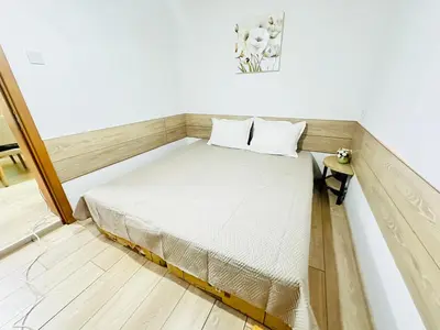 a small bed in a small room with at Вила Данели in Tsigov Chark