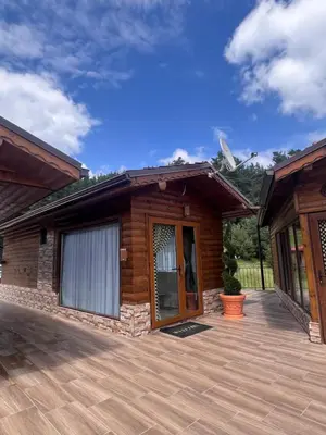 a house with a large patio in front of it at SAFI FOREST village in Dospat