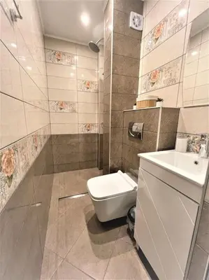 a bathroom with a toilet and a sink at Apartment in the Top center next to NDK in Sofia