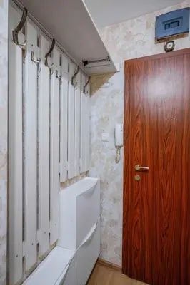 a bathroom with a toilet and a wooden door at Vitosha Boulevard Studio in Sofia