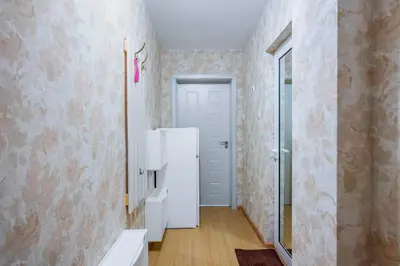 a bathroom with a white refrigerator in a room at Vitosha Boulevard Studio in Sofia