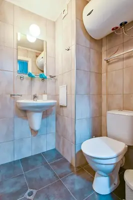 a bathroom with a toilet and a sink at Studio 19 in Sofia